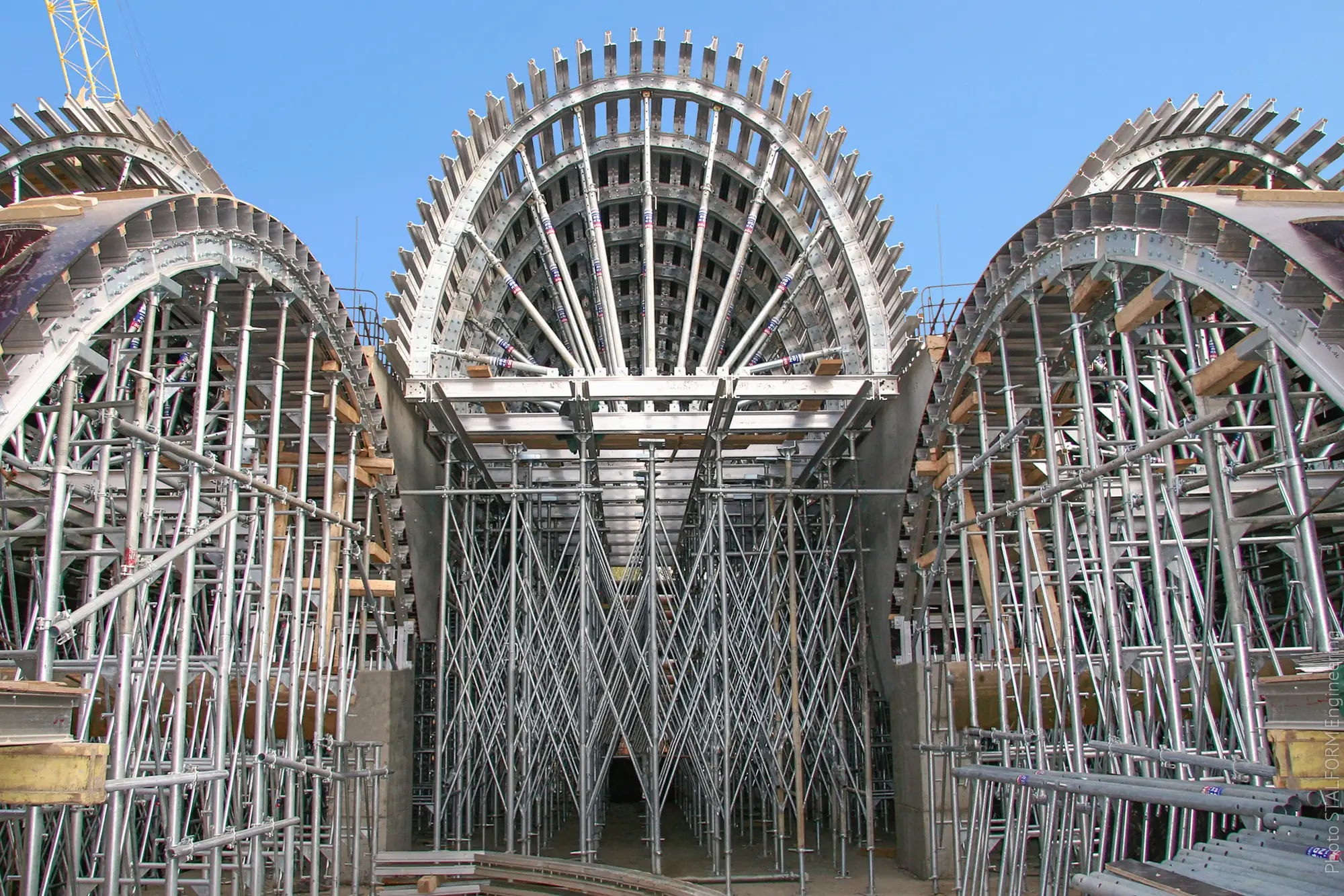 Falsework arches for a concrete structure, rising like a cathedral